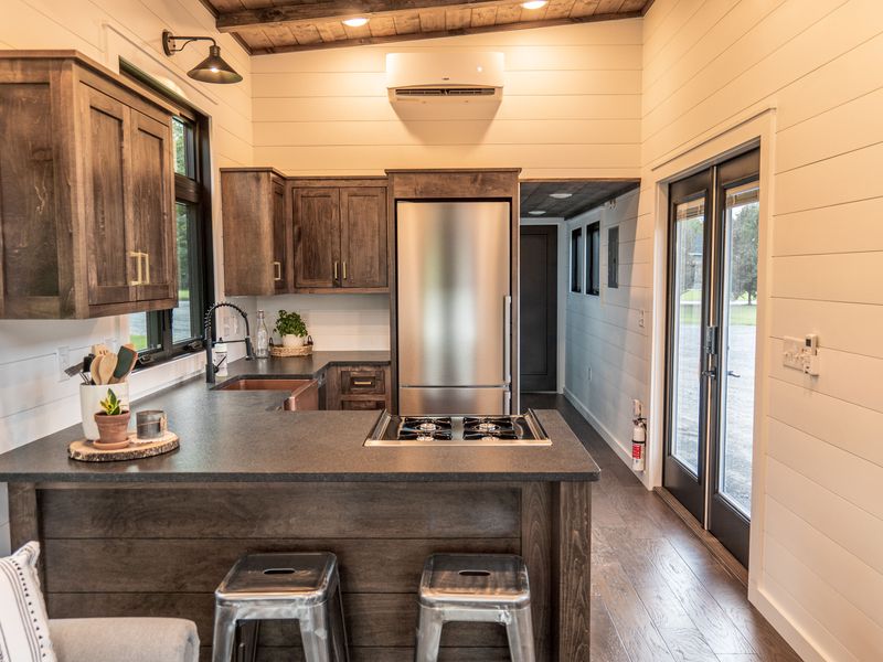 Timbercraft Big Sky model is a modern rustic and luxurious tiny home park model! image 2