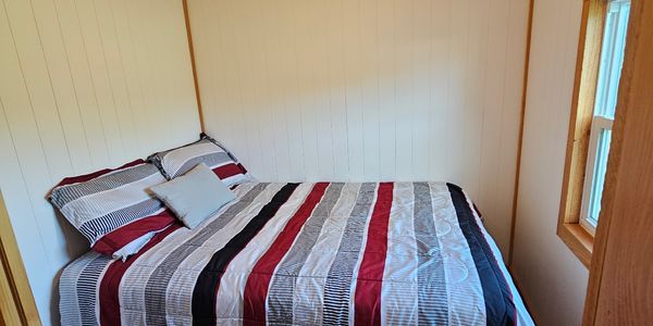 Off-Grid Ready- One-Level Tiny Home for Sale | Main Floor Bedroom image 5
