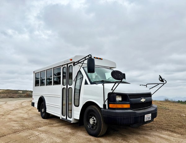 Bright Road-Ready Short Bus Tiny Home – Only 32,000 Miles!