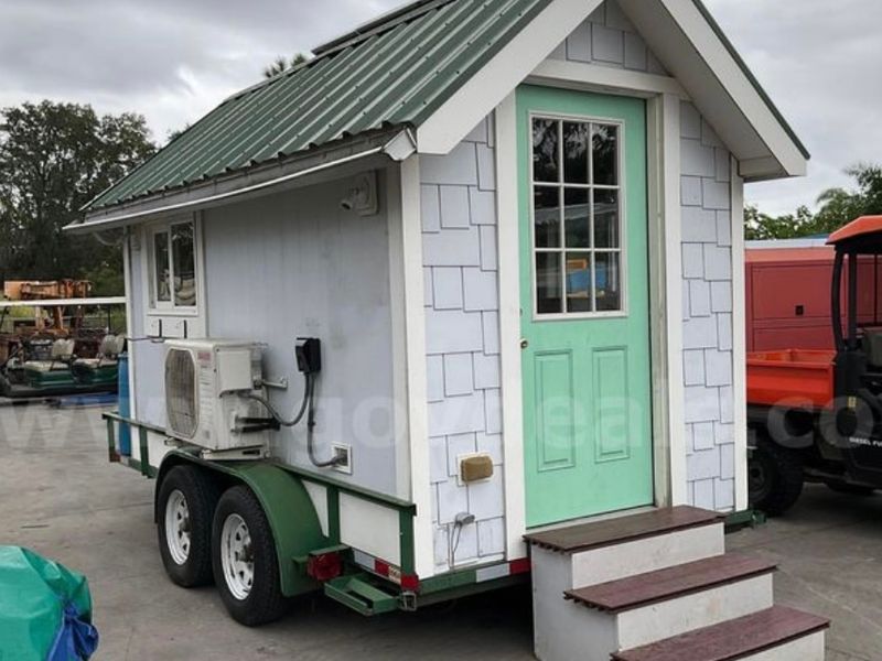 trailer mounted tiny house with solar powered energy image 1